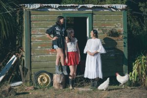 Three people chatting